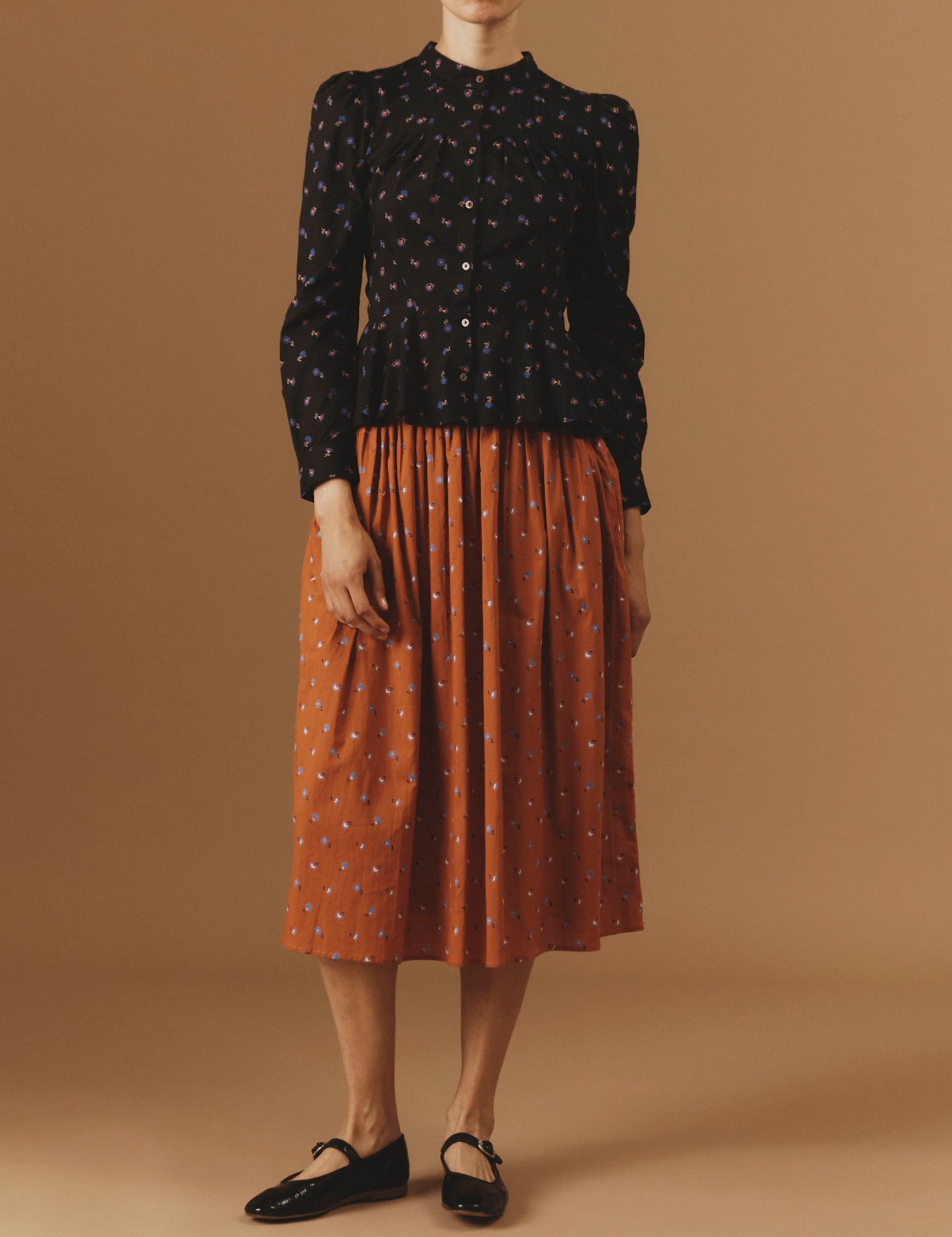 View front of Alix Black Carnation Print Blouse with Verde Orange Skirt  by Thierry Colson - Pre Spring
