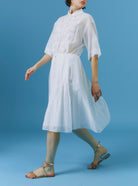 Side view of Oriane white knee dress by Thierry Colson