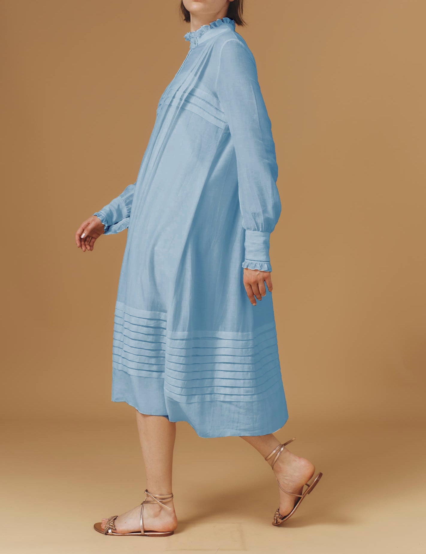 Side view of Zita Optical Pleats Heaven Blue dress by Thierry Colson