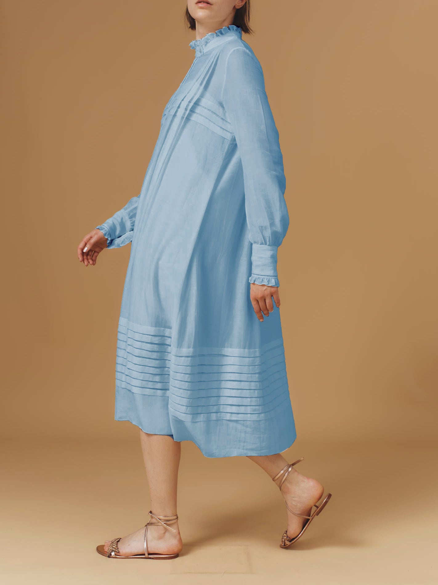 Side view of Zita Optical Pleats Heaven Blue dress by Thierry Colson