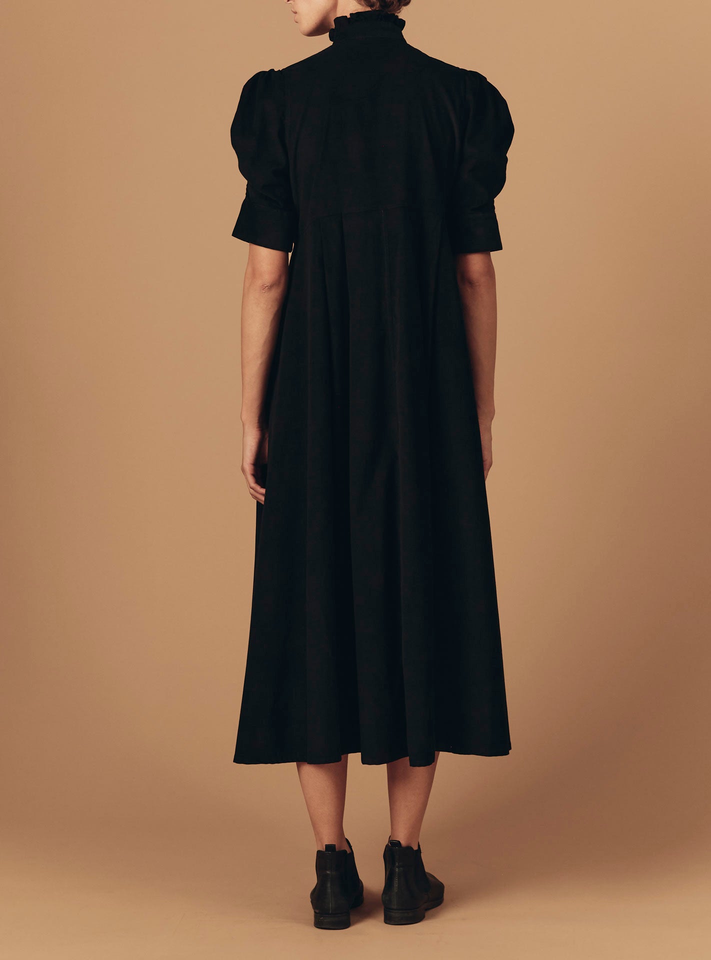 Back view of Venetia Black Plain Corduroy Dress by Thierry Colson