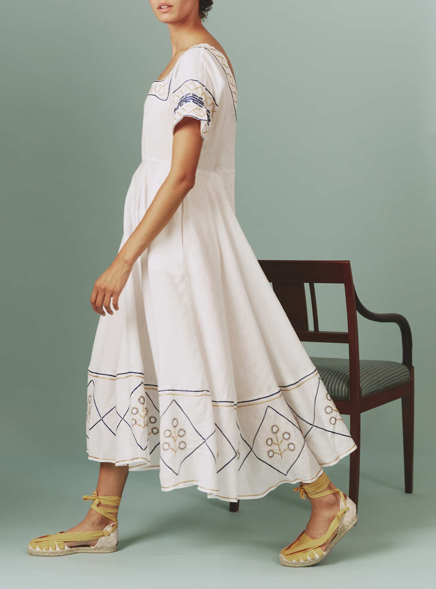 Side view of Allegria Dress: Archaic Embroidery in White by Thierry Colson