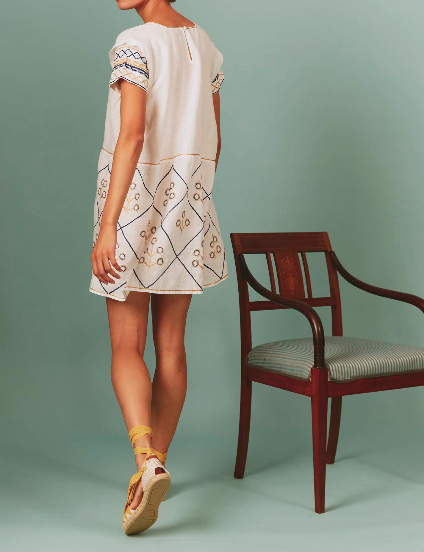 Back view of Allison Mini Dress: Archaic Embroidery in White by Thierry Colson