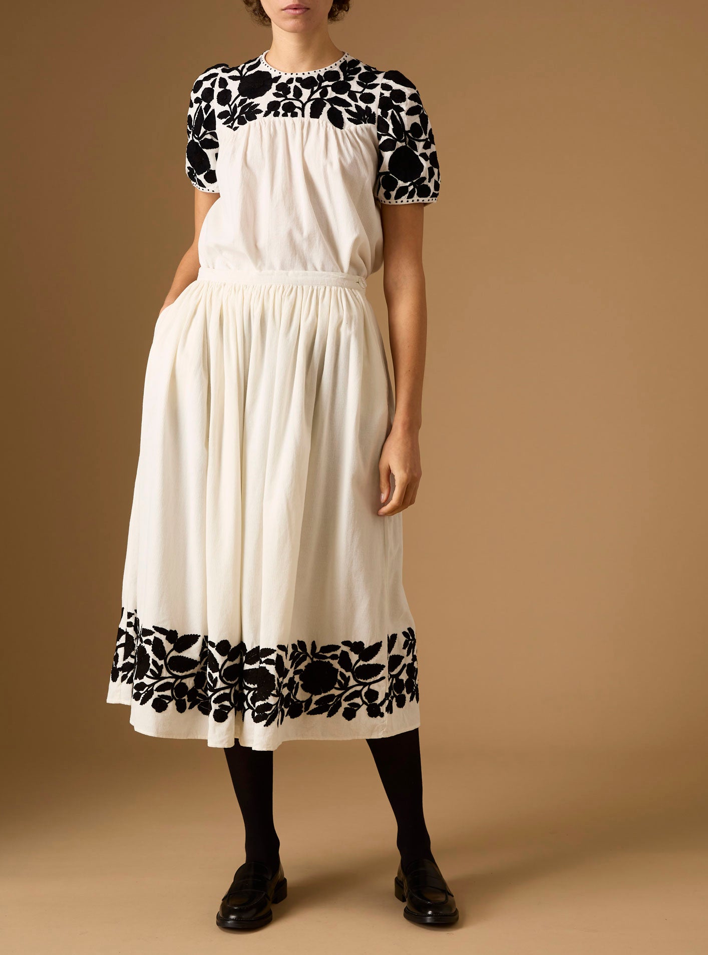 Front view of Olympia Embroidered Corduroy Cream/Black Top with skirt by Thierry Colson 