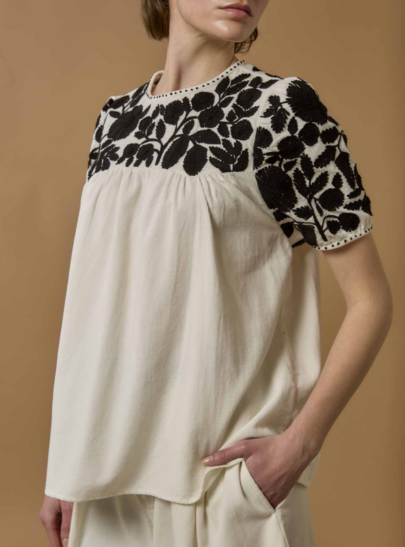 Detail - Side view of Olympia Embroidered Corduroy Cream/Black Top with Kenya Short by Thierry Colson 