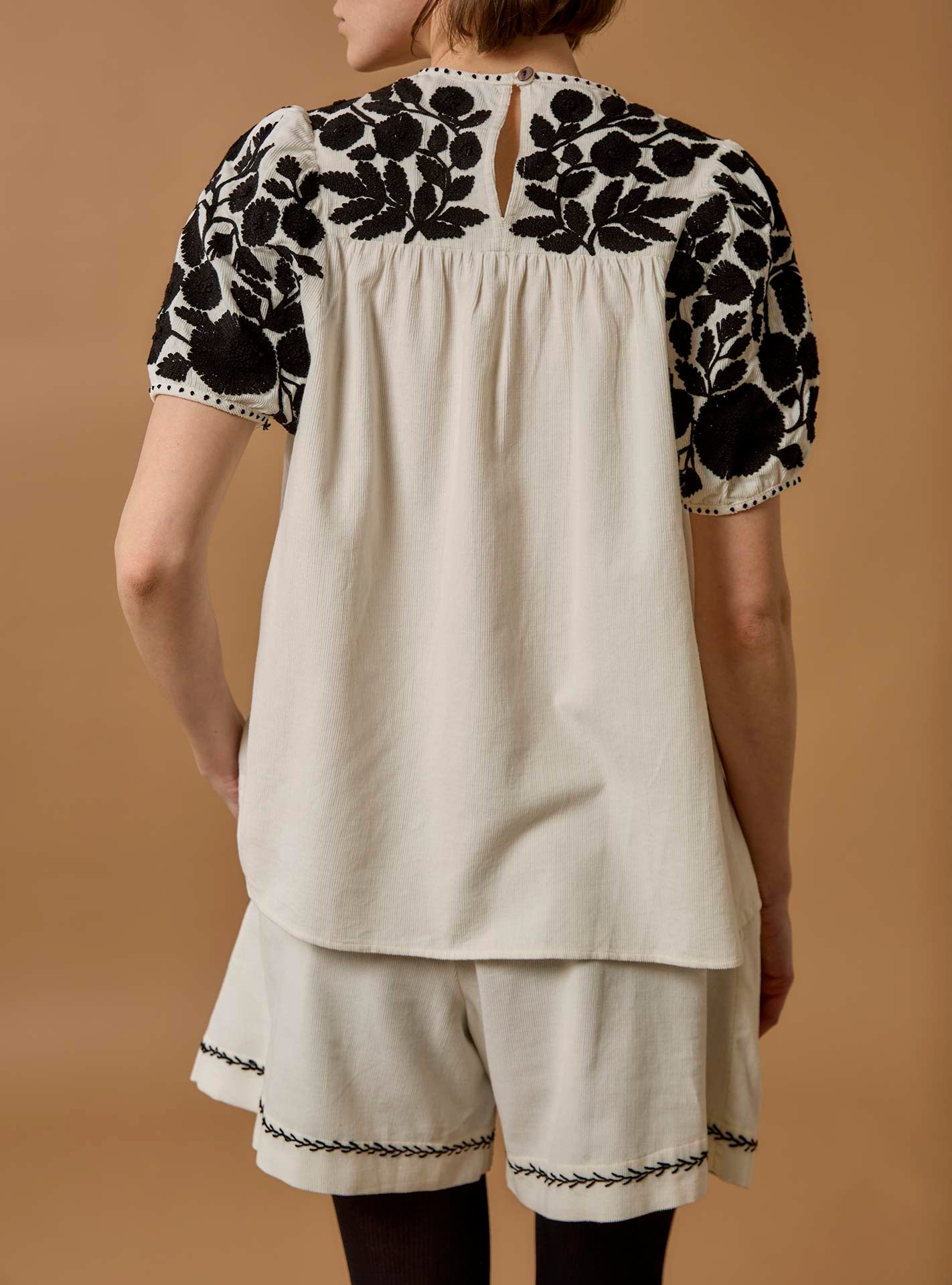 Back view of Olympia Embroidered Corduroy Cream/Black Top with Kenya Shorts by Thierry Colson 