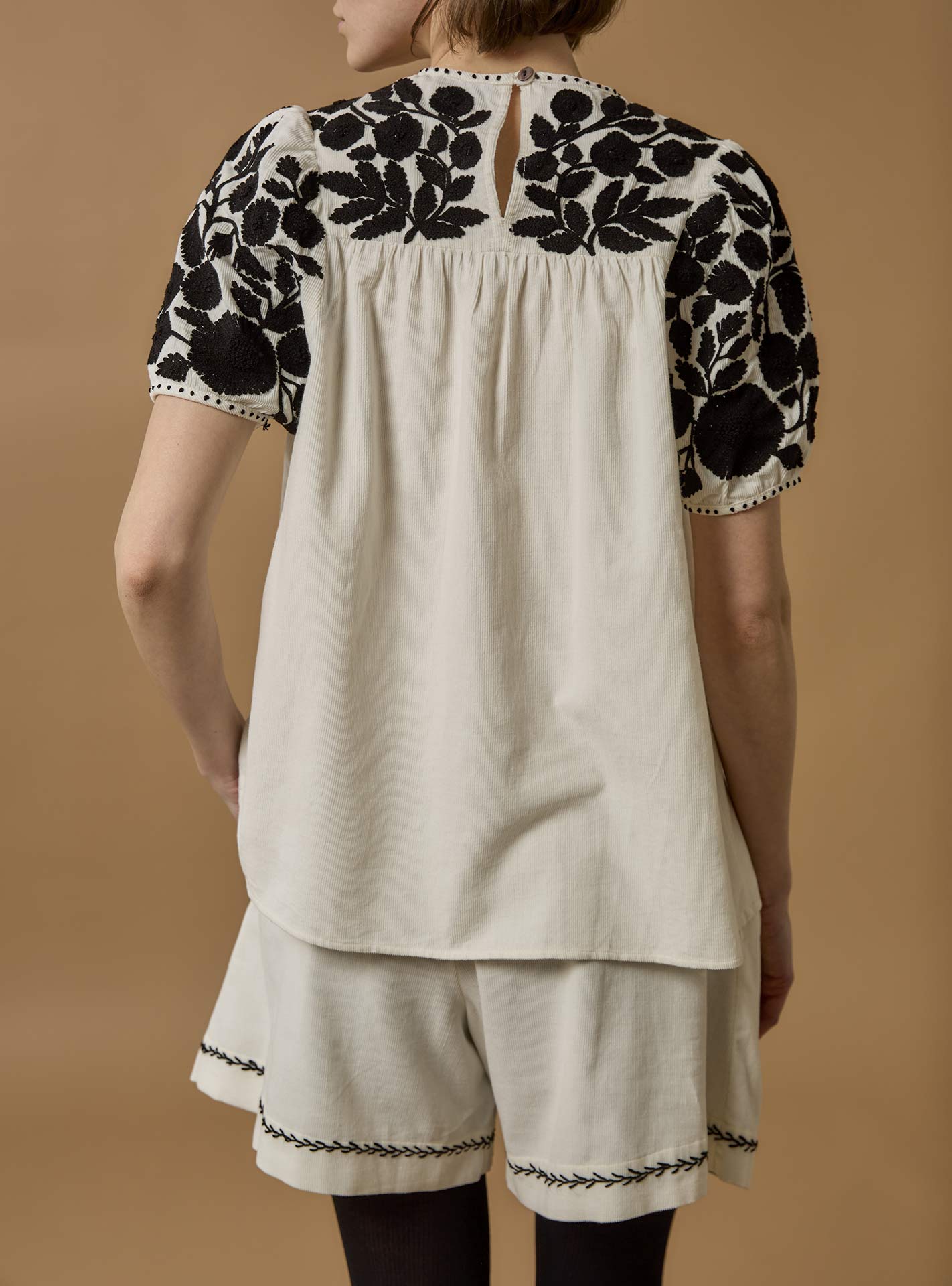 Back view of Olympia Embroidered Corduroy Cream/Black Top with Kenya Shorts by Thierry Colson 