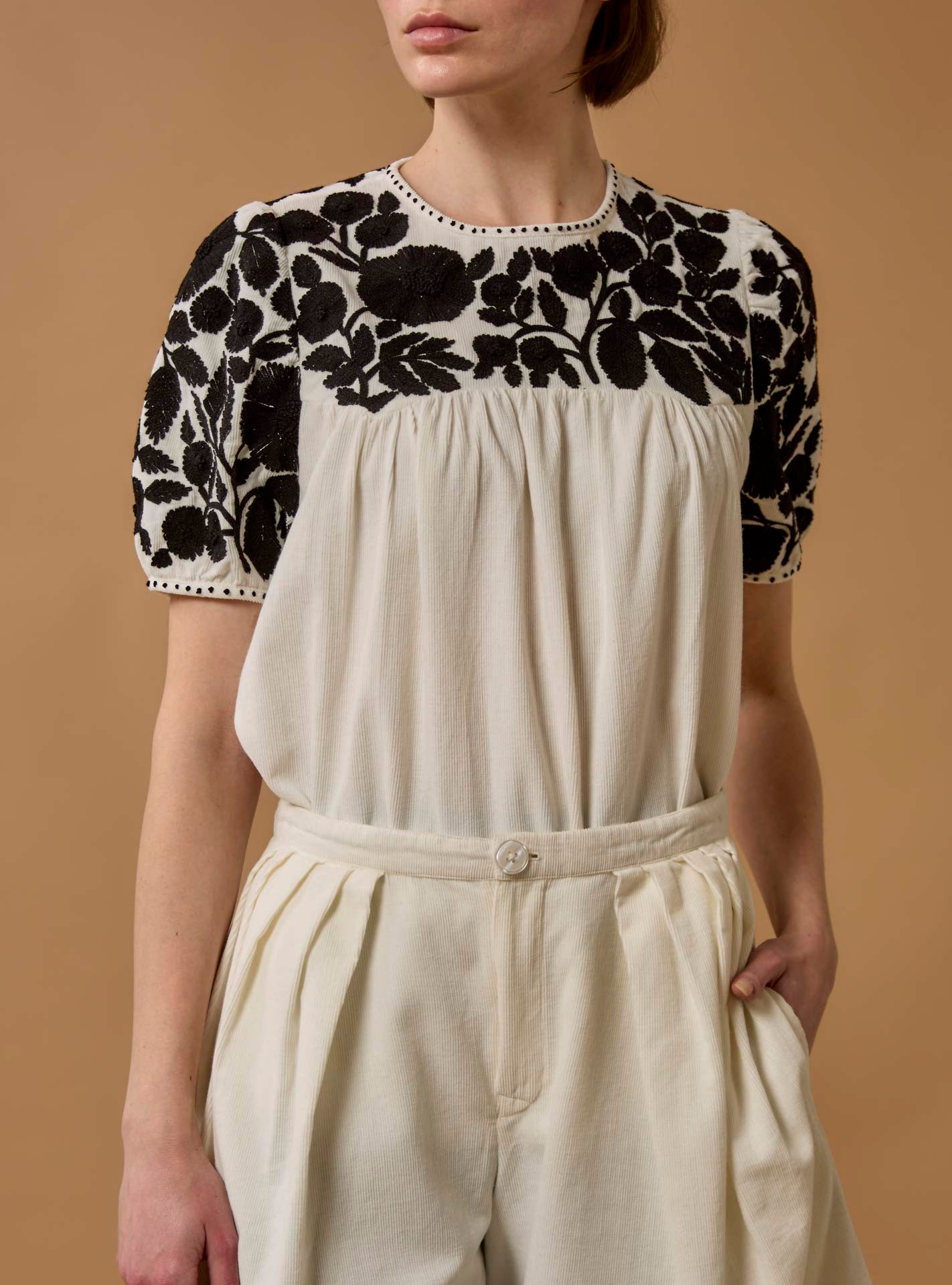Detail Front view of Olympia Embroidered Corduroy Cream/Black Top with Kenya Shorts by Thierry Colson 