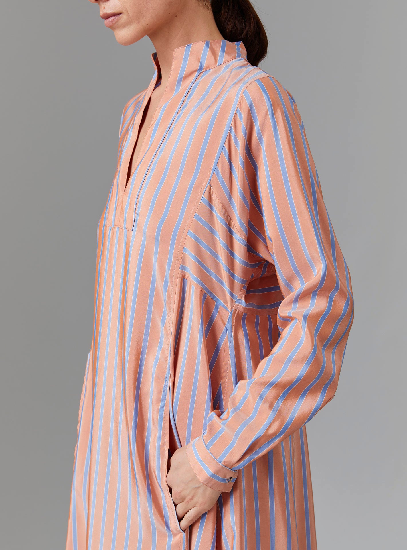 Close up view of Parvati Long Kaftan - Silk Road Stripes - Orange/Blue by Thierry Colson