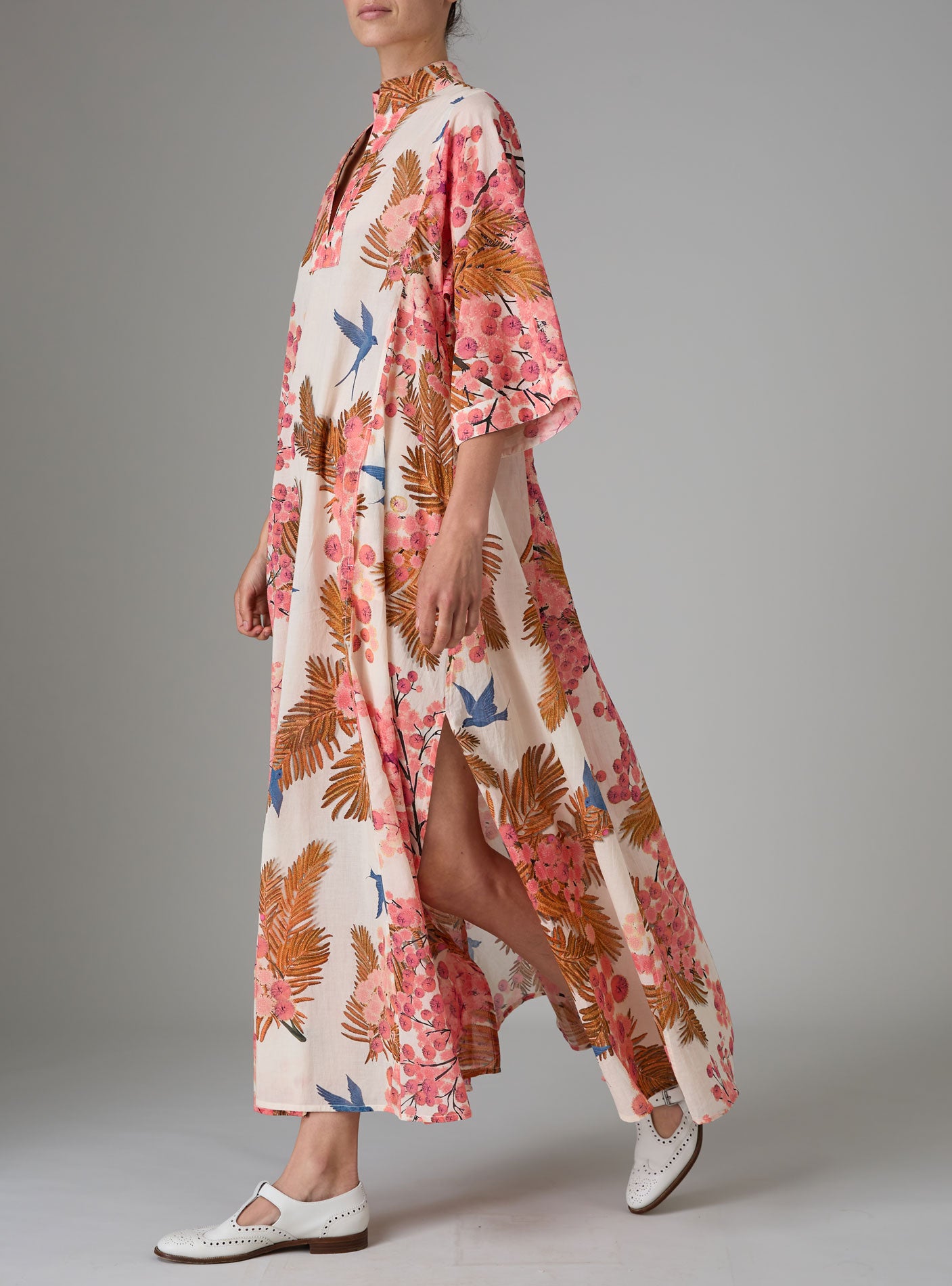 Side view of Rachel Long Kaftan with pagoda sleeves in light cotton voile, featuring pink and off-white Garden of Eden print. PS25 by Thierry Colson