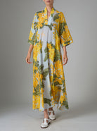 Front view of Rachel Kaftan in yellow and storm blue, featuring pagoda sleeves and high slit, inspired by mimosa gardens of the French Riviera. PS25 collection by Thierry Colson