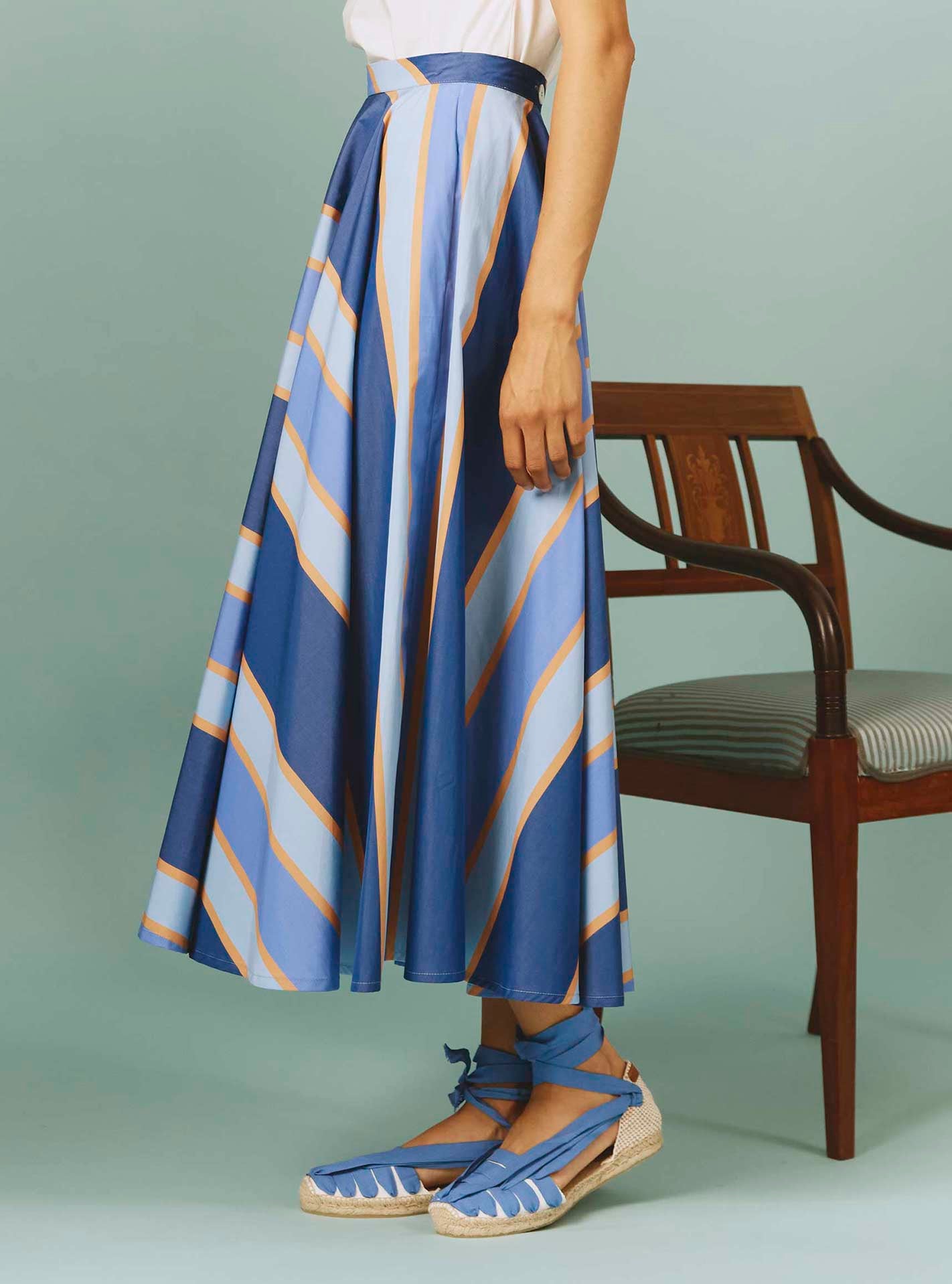Side view of Audrey Skirt: Samarkand Stripes - Blue/Arancio by Thierry Colson | Spring/Summer 2024