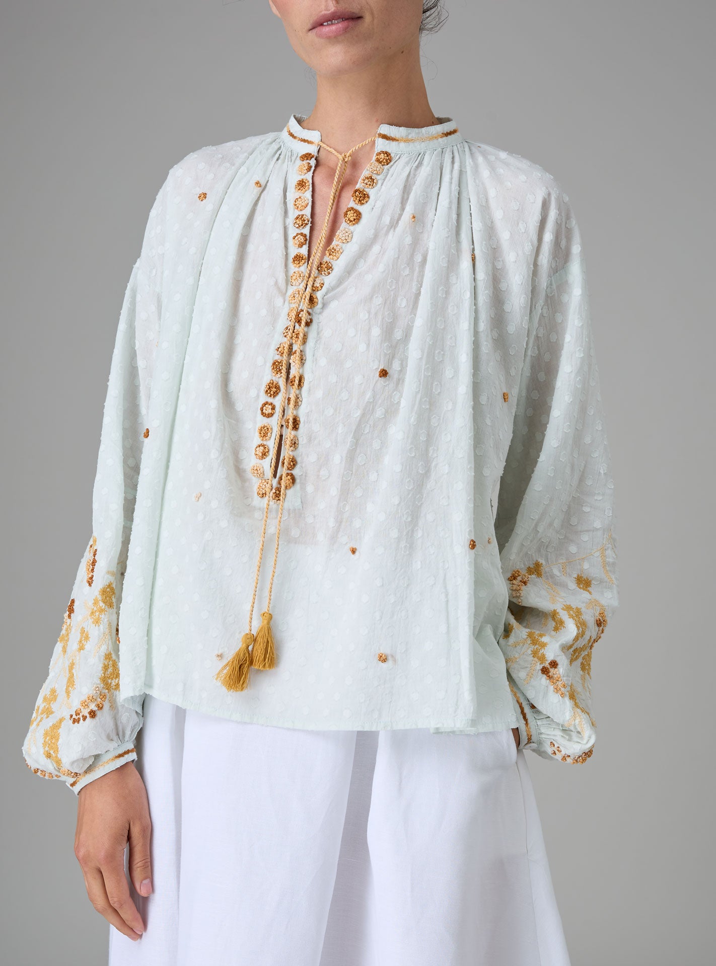 Front view of Guise Blouse in dobby cotton voile with Mediterranean-inspired hand embroidery by Thierry Colson