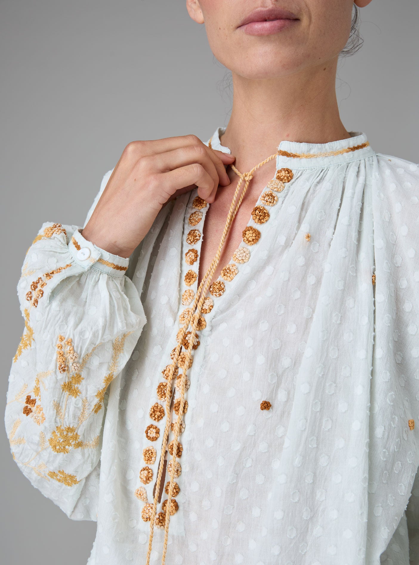 Detail of Guise Blouse in dobby cotton voile with Mediterranean-inspired hand embroidery by Thierry Colson