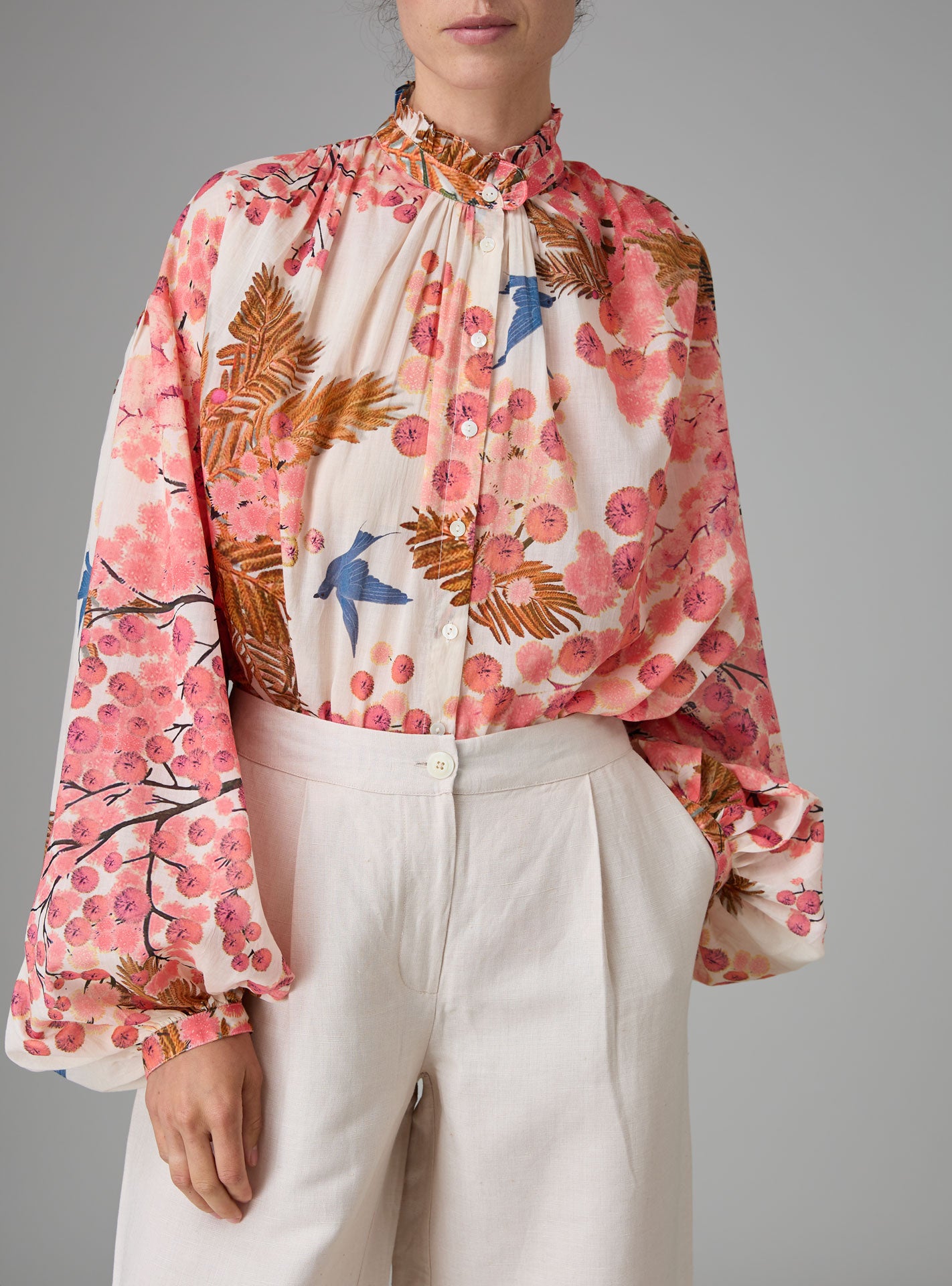 SLAVA blouse with wide bell sleeves and collar band, crafted in pink and off-white digitally printed cotton voile for Pre-Spring 2025 by Thierry Colson