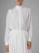 Front view of Teresa Blouse in silk cotton with high collar and pintuck details by Thierry Colson