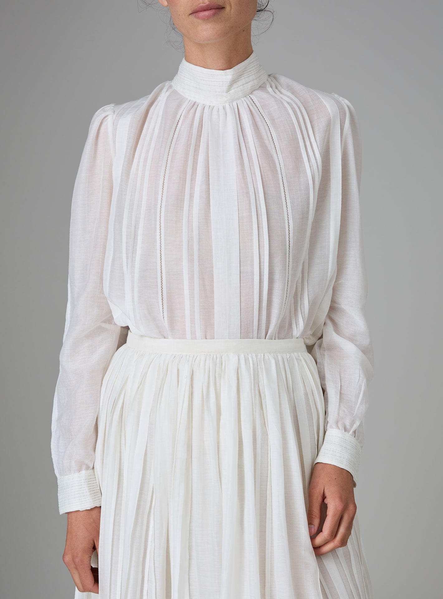 Front view of Teresa Blouse in silk cotton with high collar and pintuck details by Thierry Colson