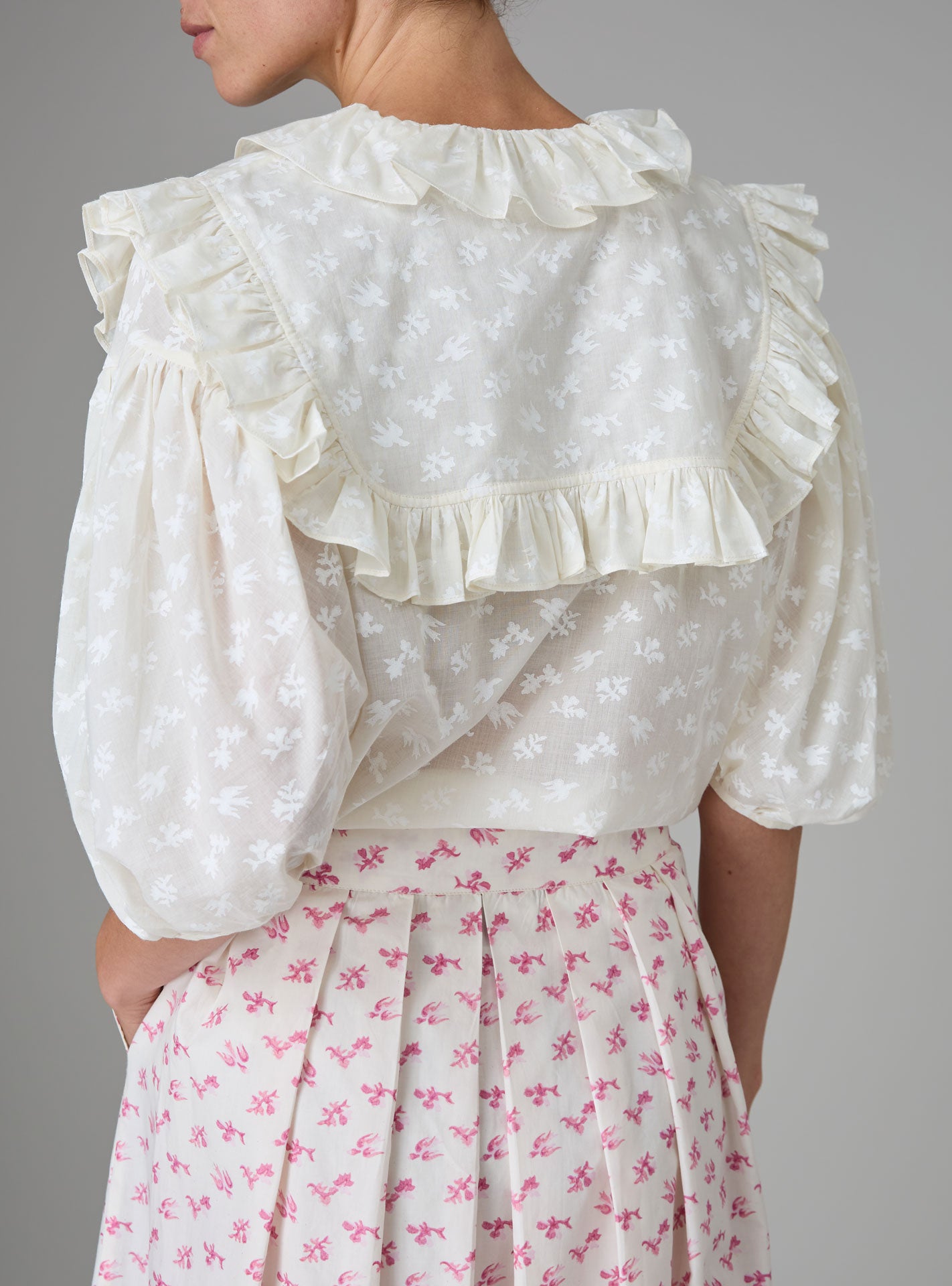 Back view of Vanina Romantic Blouse Hand Block-Printed Birds Flowers Ruffled Collar by Thierry Colson