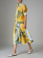 Large view of Wynona skirt & VITA blouse with Gigot sleeves and ruffle collar in yellow and storm blue digitally printed cotton voile, inspired by French Riviera mimosa gardens. Thierry Colson collection