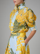 VITA blouse with Gigot sleeves and ruffle collar in yellow and storm blue digitally printed cotton voile, inspired by French Riviera mimosa gardens. Thierry Colson collection