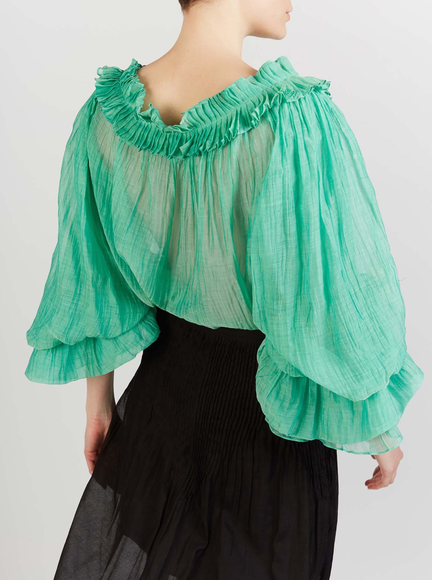 Back view of Roussia Veridian Green Blouse by Thierry Colson photographed by Stéphane Gautronneau