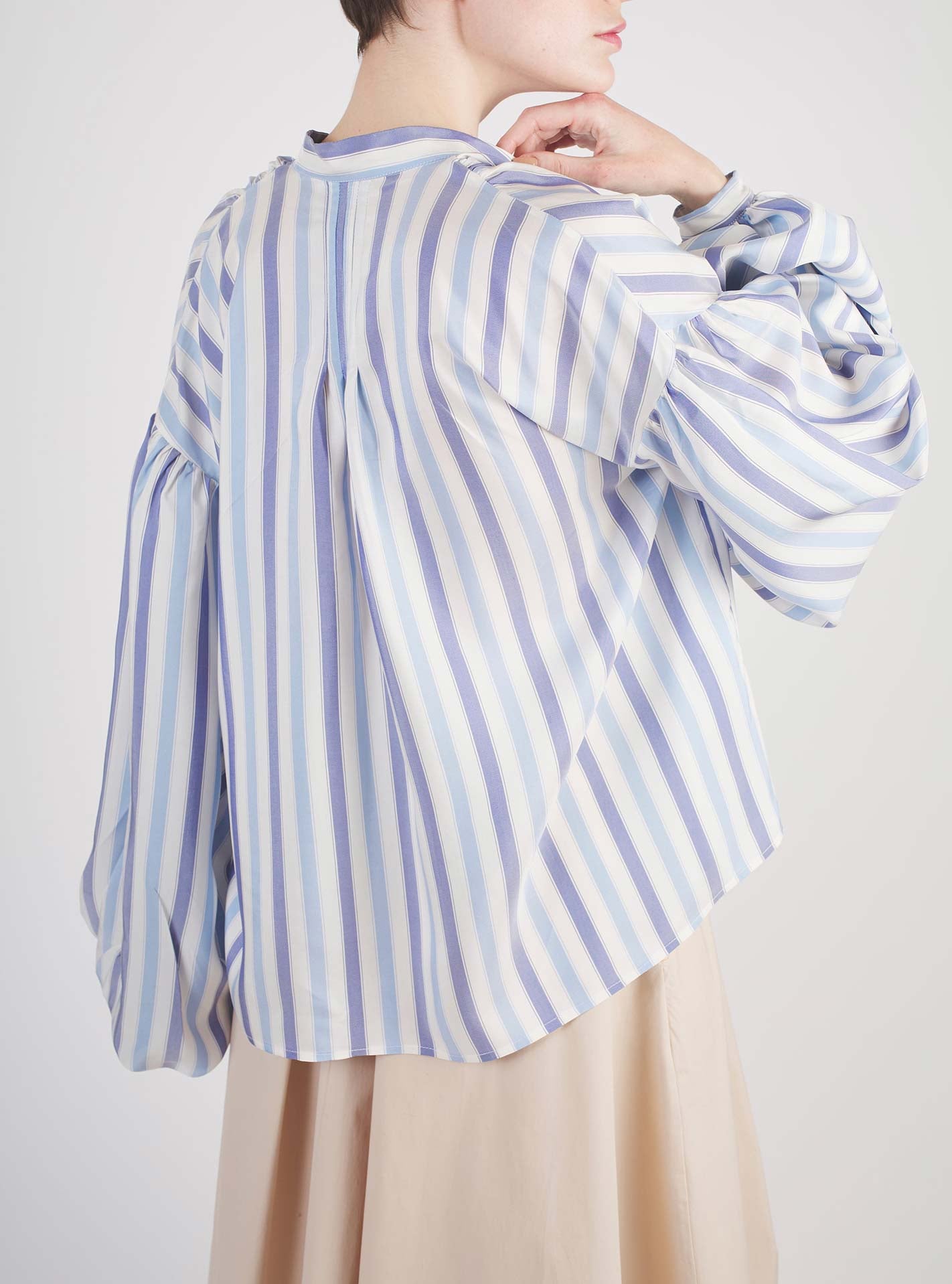 Back view of Slava Ottoman Stripes Blue Sky & Navy Blouse by Thierry Colson