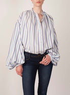 Front view of Slava Ottoman Stripes Blue Sky & Navy Blouse with a jeans by Thierry Colson