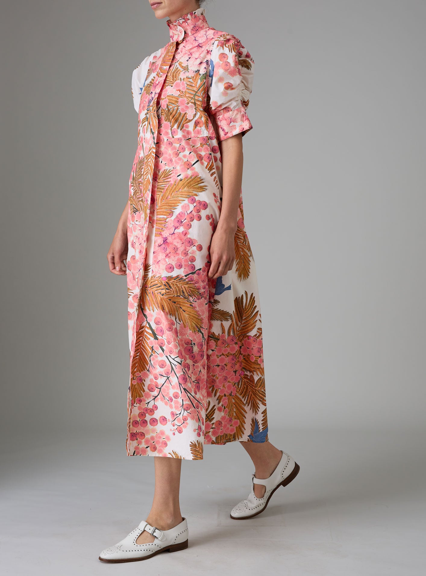 Other side view of VENETIA dress with frilled collar and Gigot sleeves, crafted in pink and off-white Italian poplin with Garden of Eden print for Pre-Spring 2025 by Thierry Colson