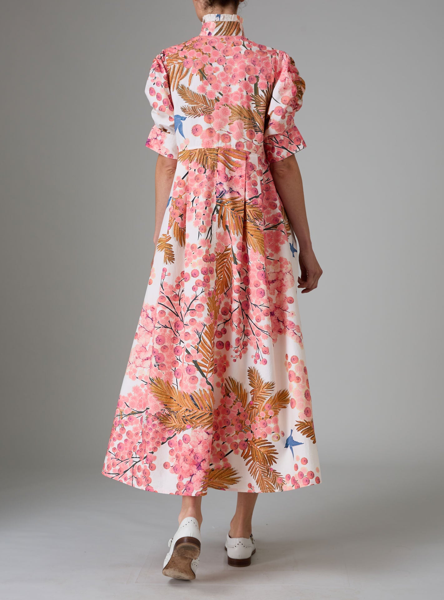 Back view of VENETIA dress with frilled collar and Gigot sleeves, crafted in pink and off-white Italian poplin with Garden of Eden print for Pre-Spring 2025 by Thierry Colson