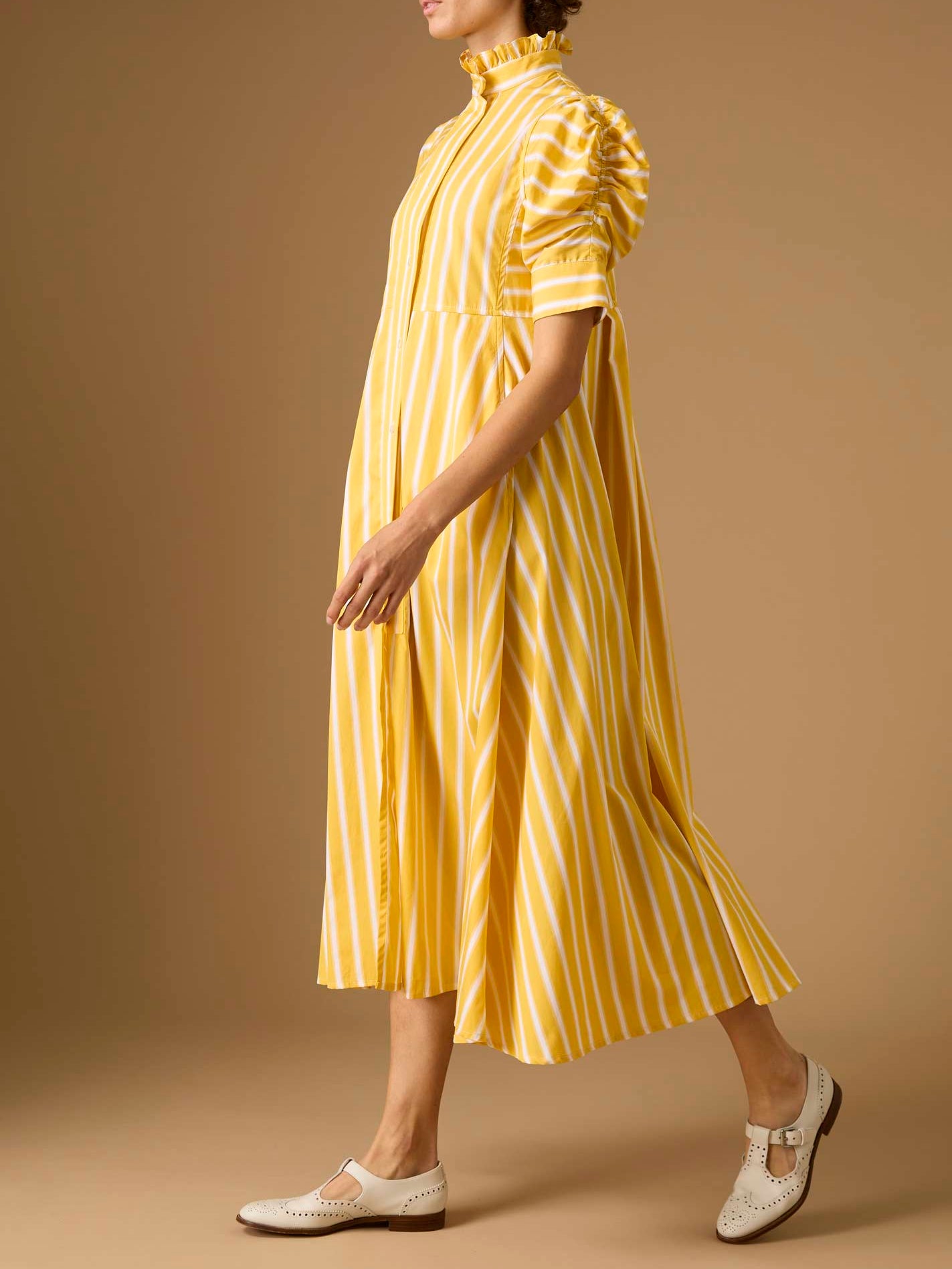 Side view of Venetia Downing Poplin Yellow Dress by Thierry Colson