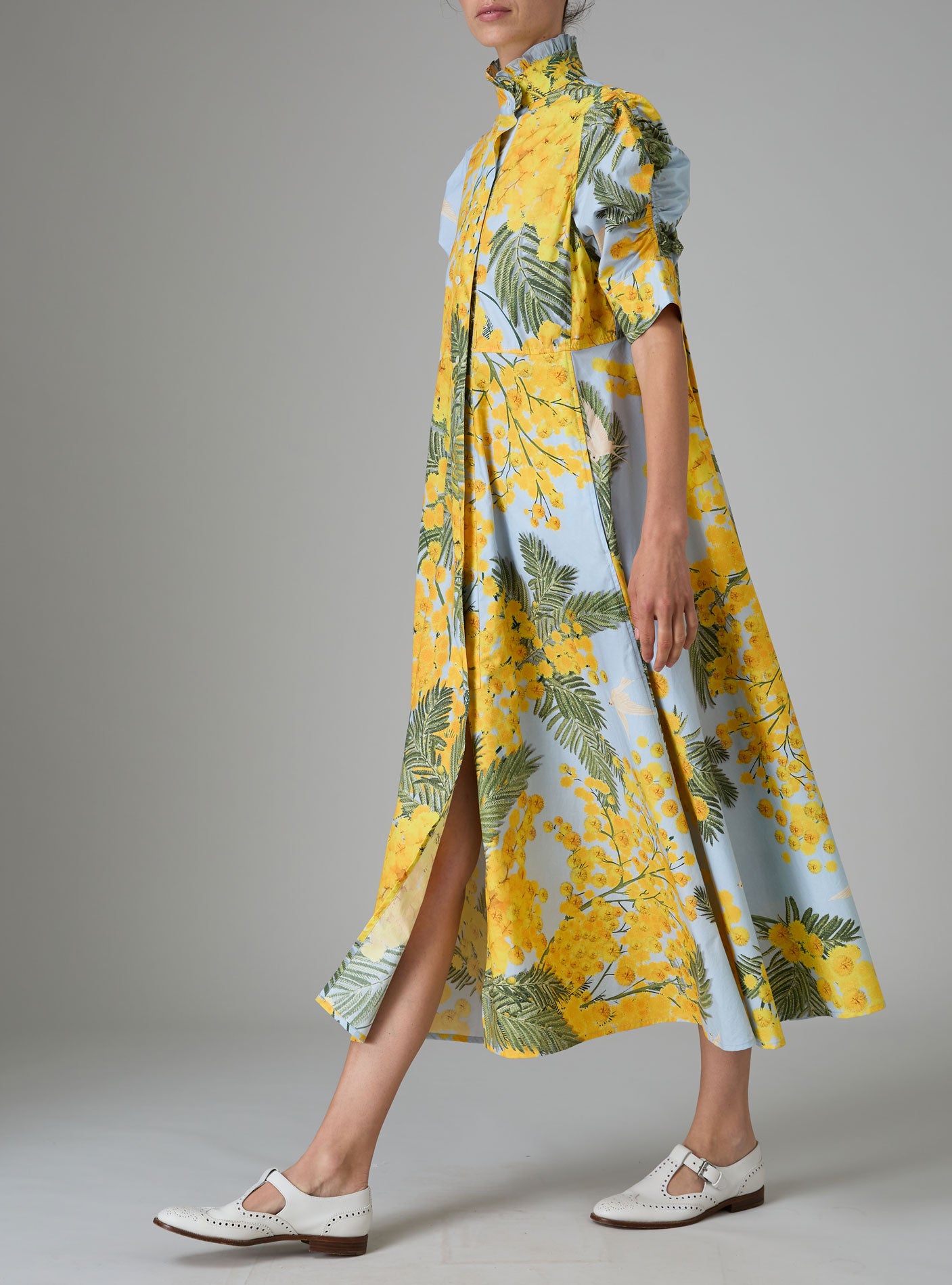 Side view of VENETIA dress in yellow and storm blue with frilled collar and Gigot sleeves by Thierry Colson