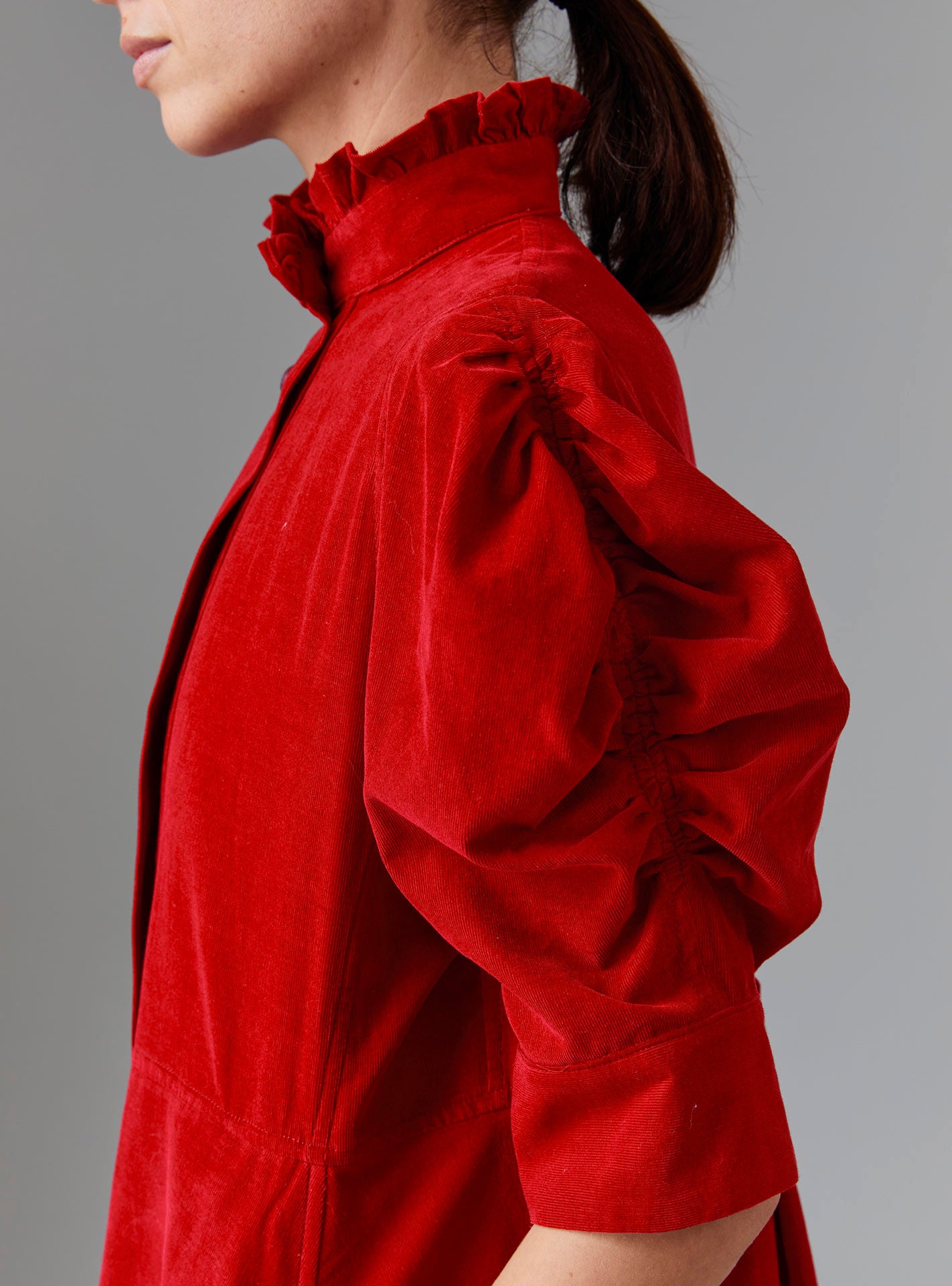 Close up view of Venetia Red Dress Sleeve - Tirolean Cord by Thierry Colson