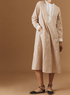 Front view of Victoria Cappuccino Midi Crinkle satin kaftan by Thierry Colson - hand in the pocket