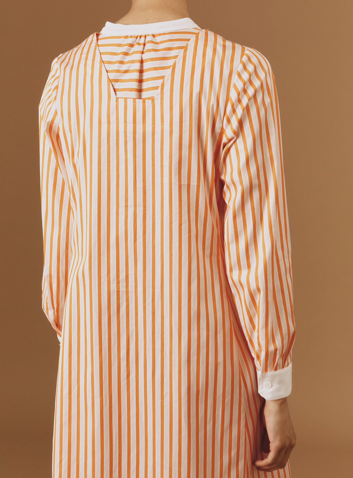 Close up back view of Victoria Midi stripes Orange/Salmon/White kaftan by Thierry Colson
