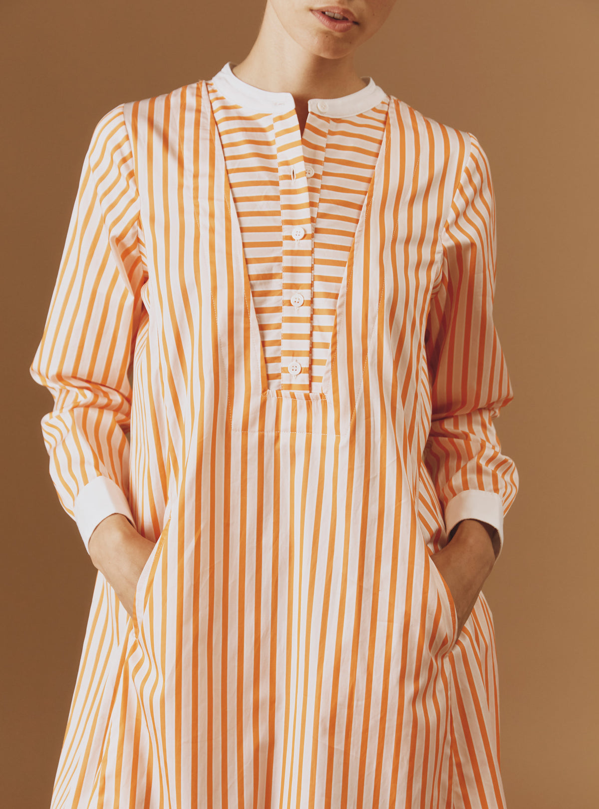 Close up Front view of Victoria Midi stripes Orange/Salmon/White kaftan by Thierry Colson