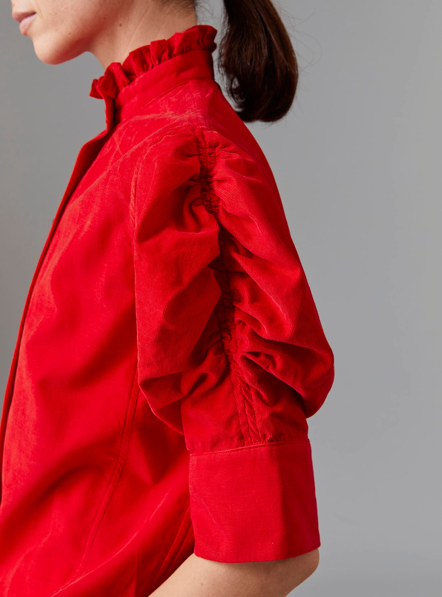 Close up view of Vita Red Blouse Sleeve - Tirolean Cord by Thierry Colson