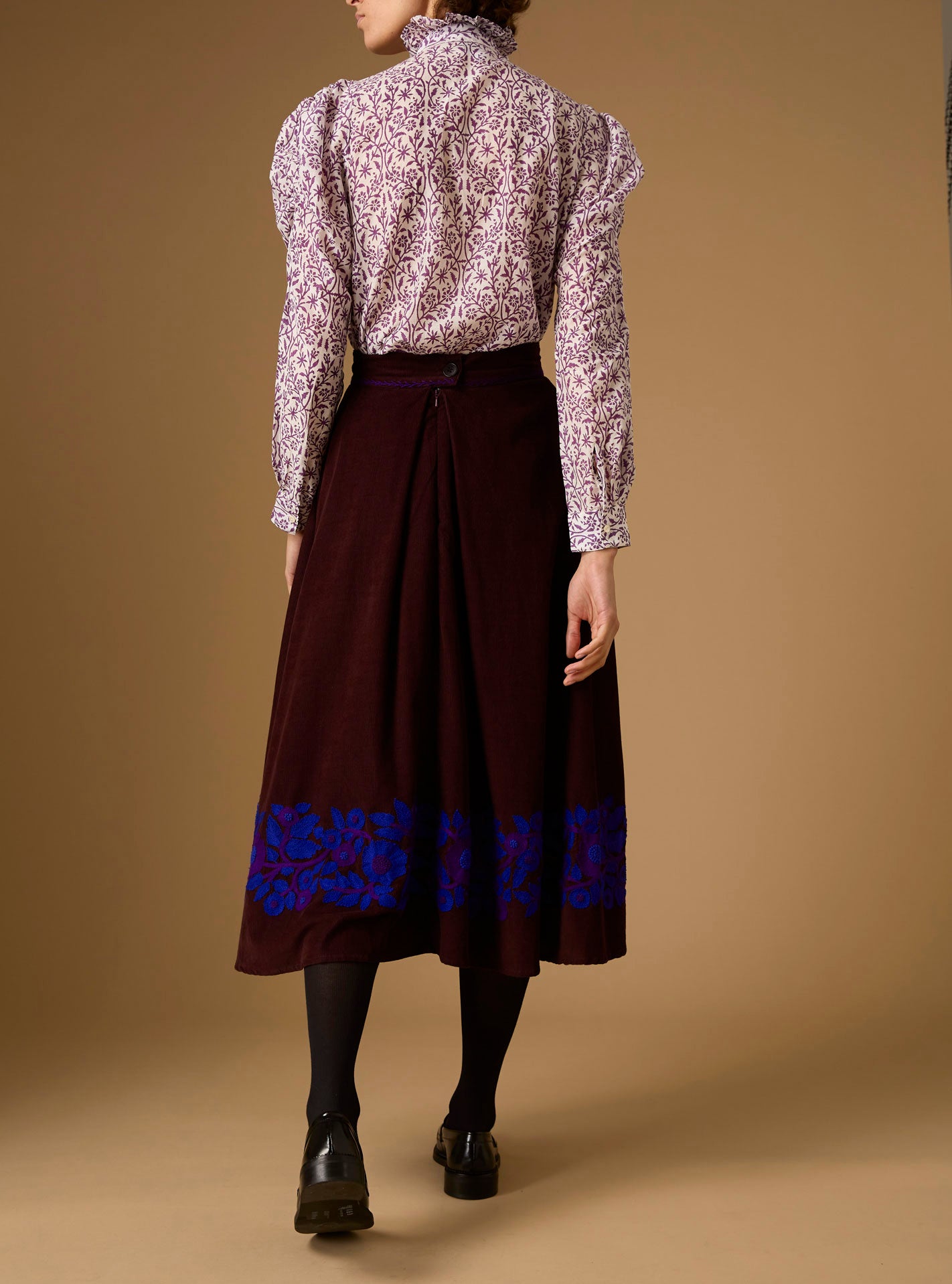 Back view of Wind Magic Purple Blouse with Wynona Skirt - Paper Cut Print by Thierry Colson 