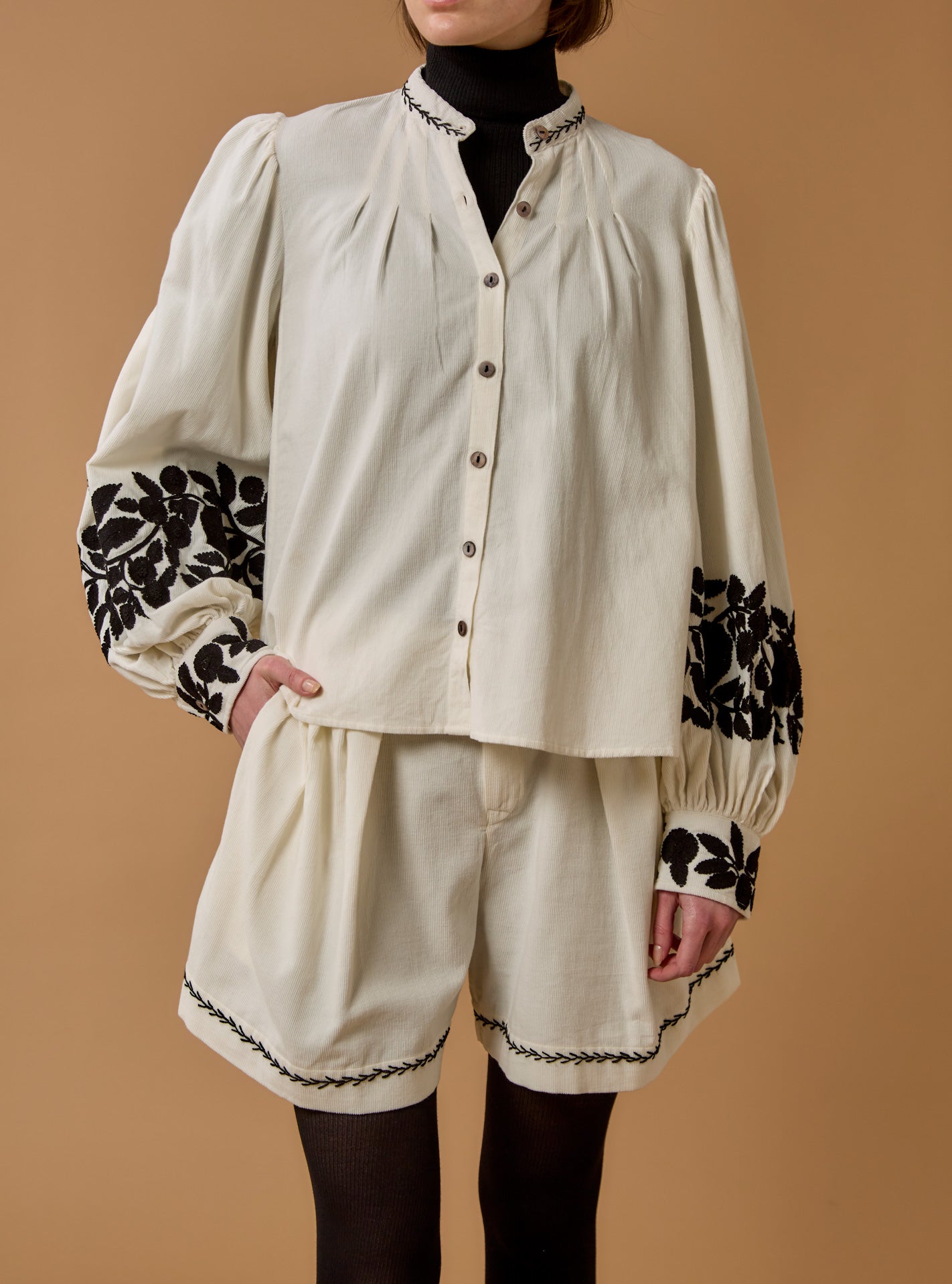Front view of Yana corduroy Cream Blouse with black embroidered by Thierry Colson