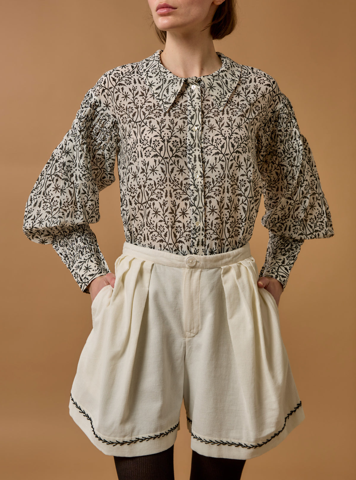 Front view of Zlata Black Blouse - Paper Cut Print by Thierry Colson