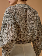 Close-up back view of Zlata Black Blouse - Paper Cut Print by Thierry Colson