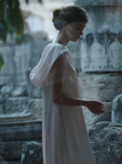 Side view of Anna wearing Eden Pink Silk Kaftan by Thierry Colson photographed by Stéphane Gautronneau