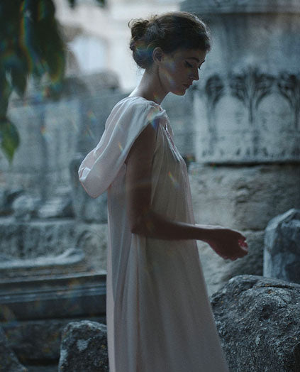 Side view of Anna wearing Eden Pink Silk Kaftan by Thierry Colson photographed by Stéphane Gautronneau