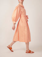 Side view of Yvonne  Mayfair Orange Dress by Thierry Colson