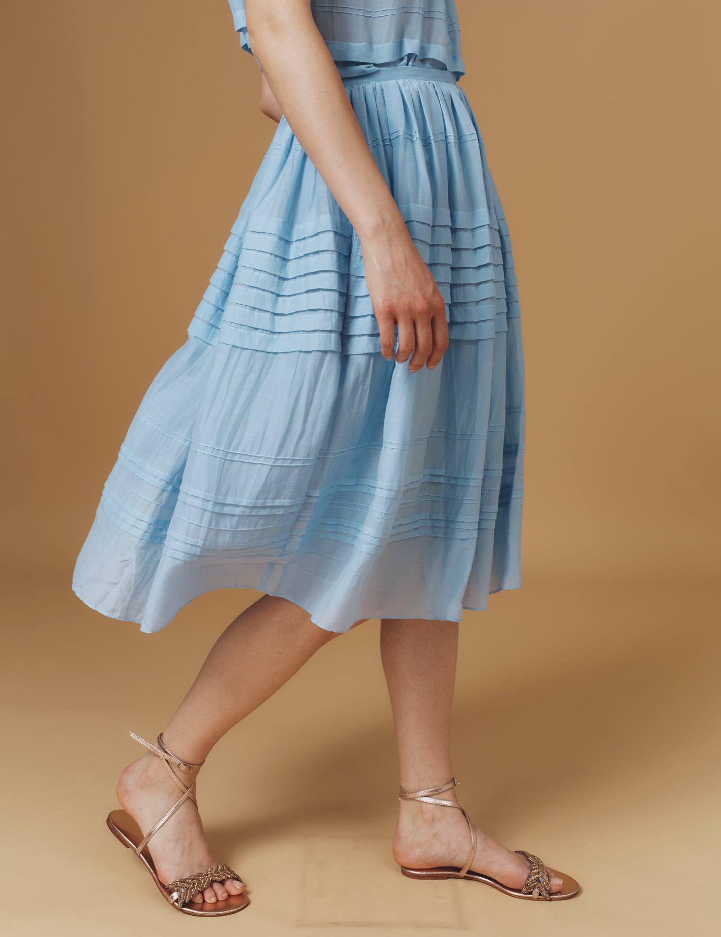 Side view of Zafar Optical Pleats Heaven Blue Skirt by Thierry Colson