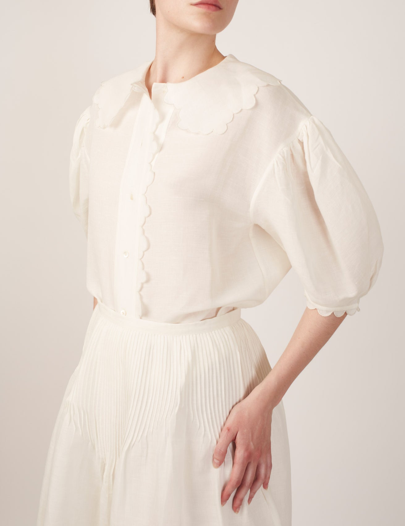Side view of Vanina Barocco Scallops Off White Blouse by Thierry Colson 