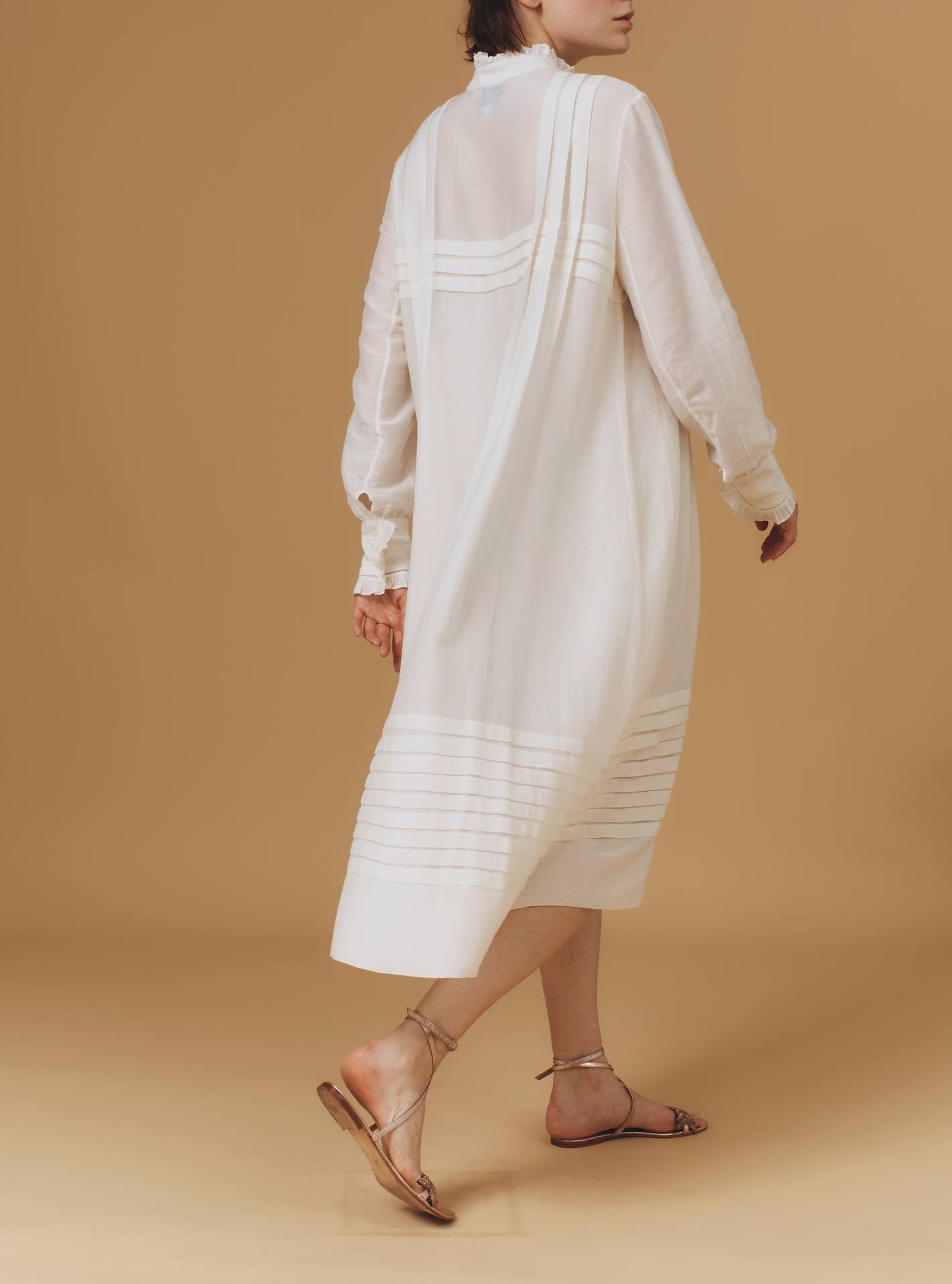 Back of Zita Optical Pleats Off White dress by Thierry Colson