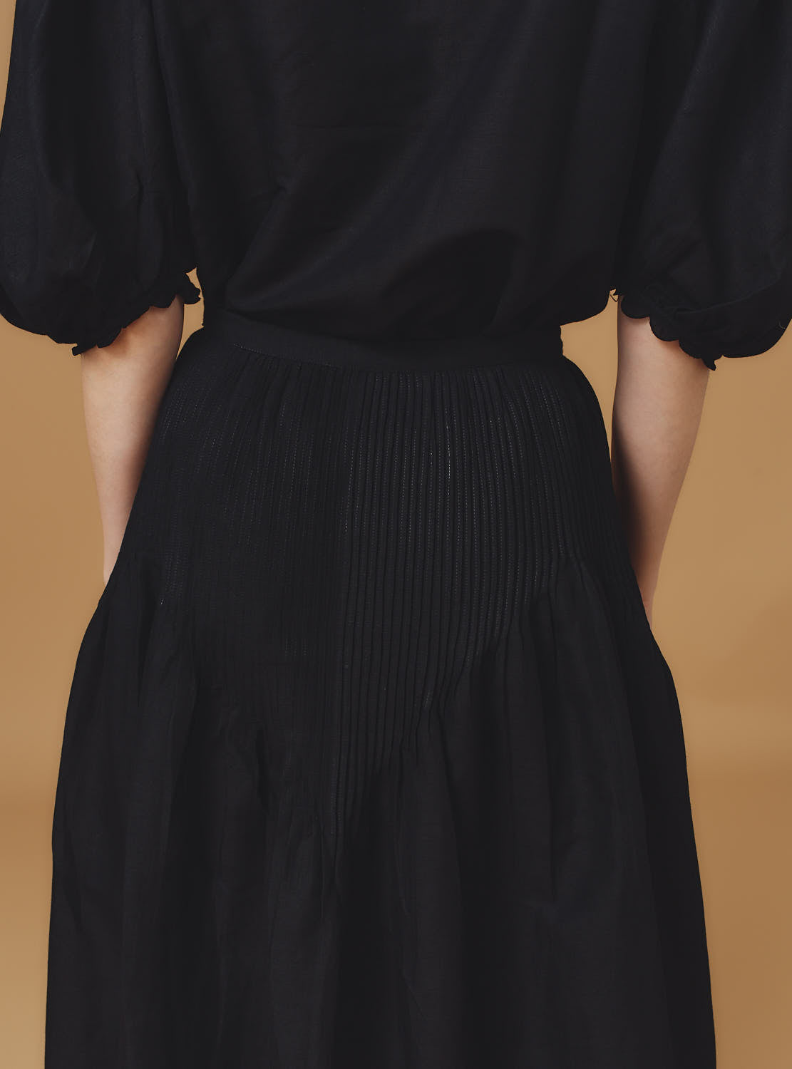 Detail back view of Verde Barocco Scallops Black Skirt by Thierry Colson