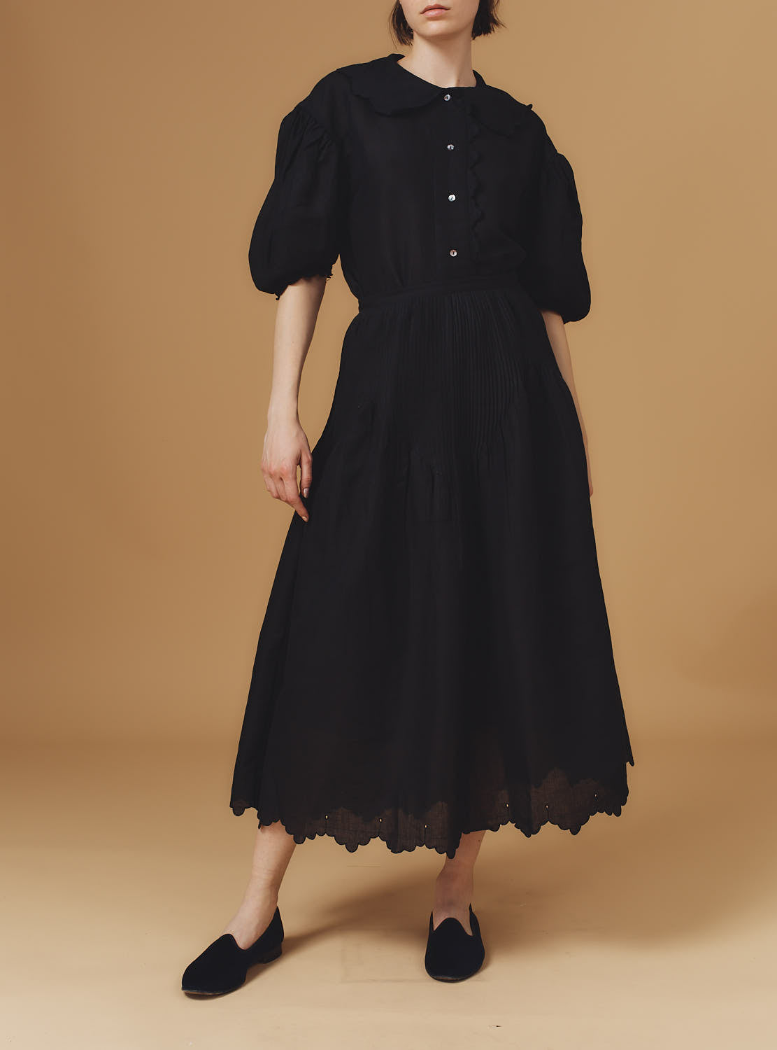 Front view of Vanina Barocco Scallops Black  Blouse with Verde Skirt by Thierry Colson