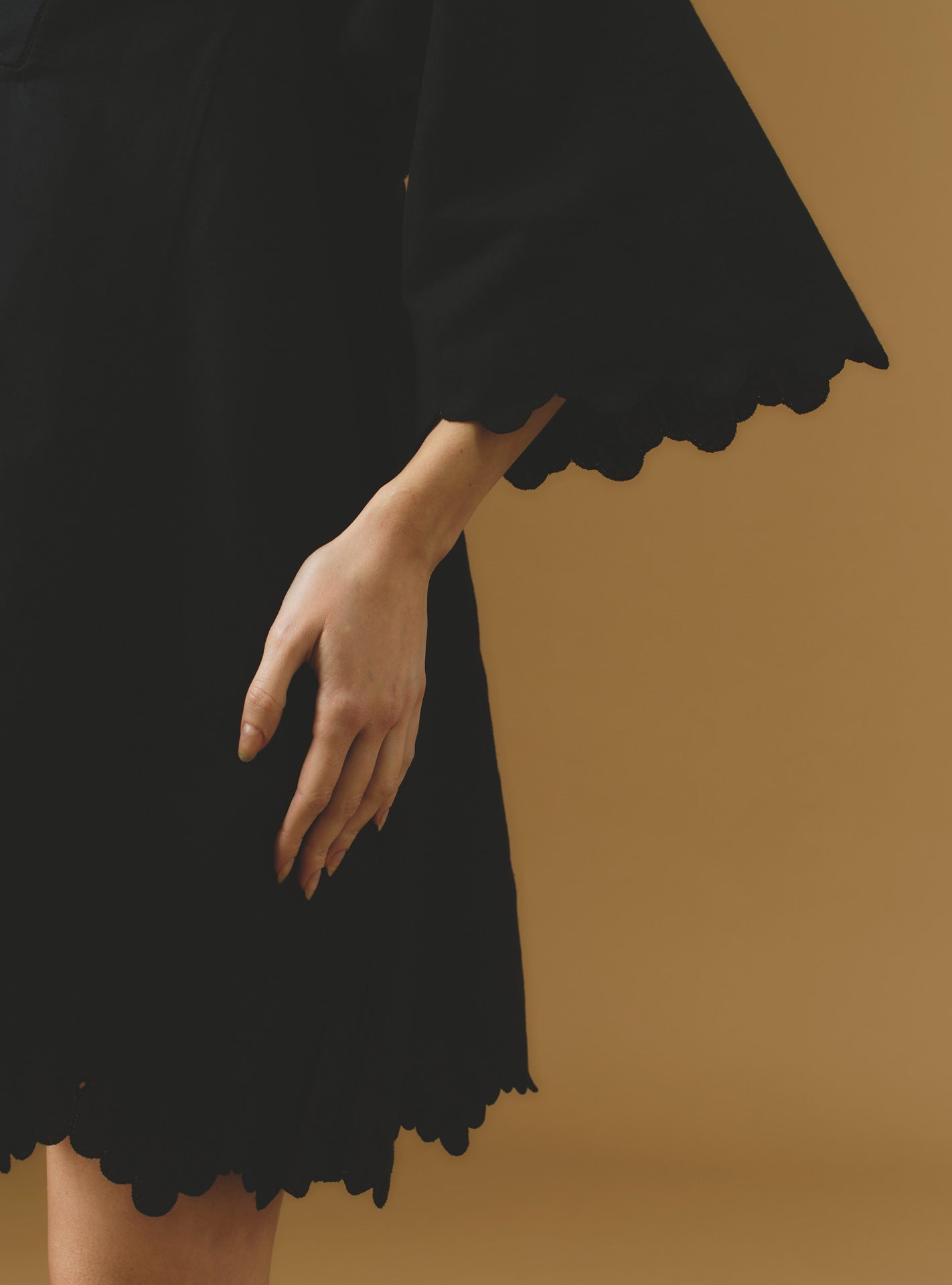 Close up sleeve view Rachel black mini Kaftan by Thierry Colson - Barocco Scallops theme