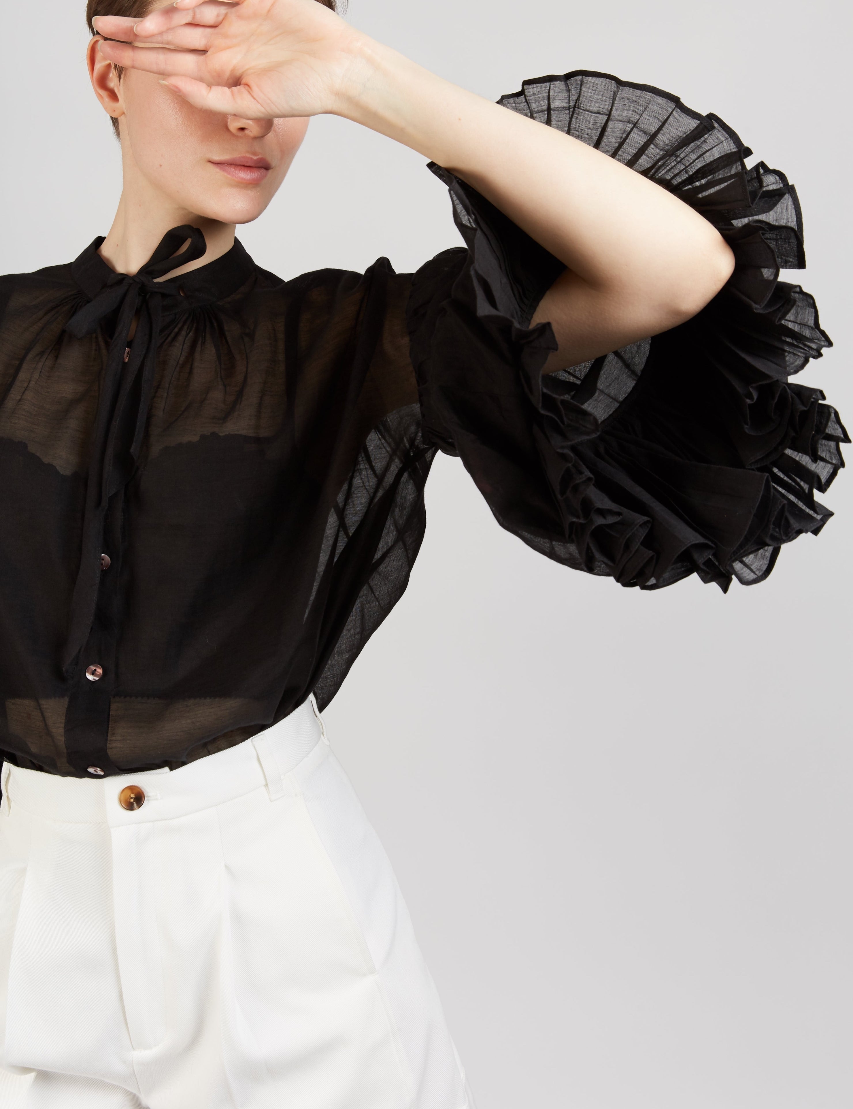 Front view of Rayne black blouse by Thierry Colson